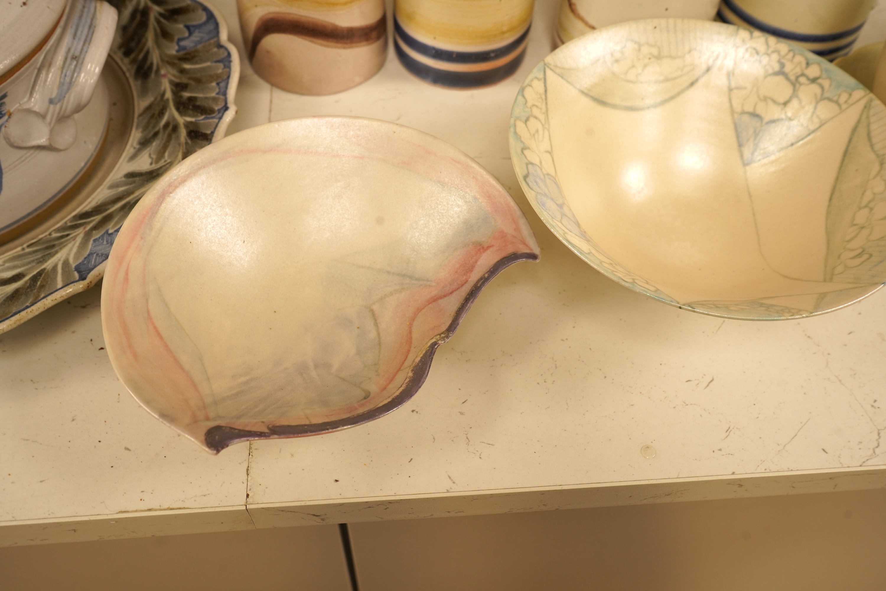 A mixed collection of European studio pottery to include a collection of four tall Italian candlesticks, tallest 58cm, two stoneware plates and a tureen and cover, etc.